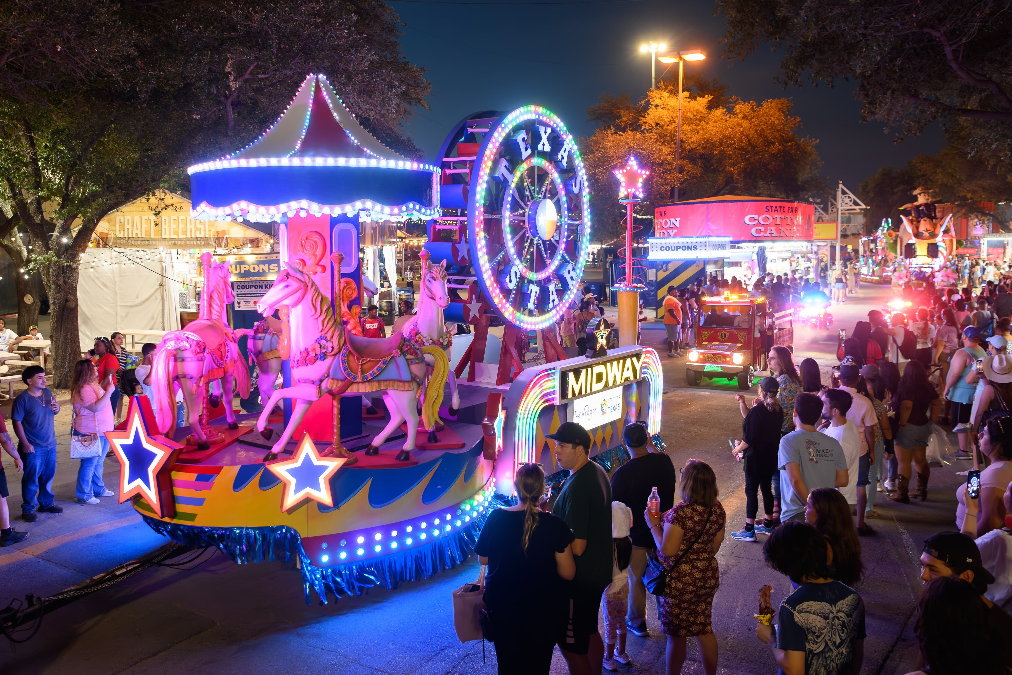 File photo: Illuminated parade floats travel through the fairgrounds at night.